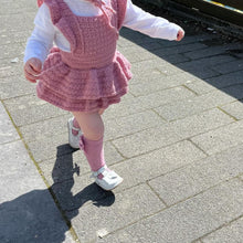 Load image into Gallery viewer, Little Girls crocheted Romper Suit with twin layered frilly skirt and frills around the straps, pictured in colour pale rose
